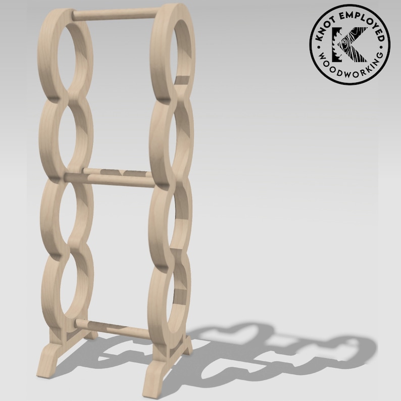 May include: A wooden towel rack with a circular design. The rack has three tiers and a base with four legs. The rack is made of light brown wood.