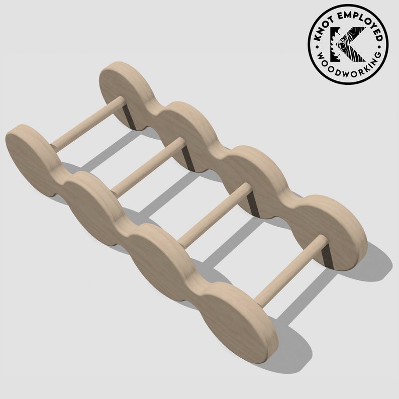 May include: A wooden wine rack with five bottle slots. The rack is made of light brown wood and has a natural finish. The rack is designed to hold wine bottles horizontally.