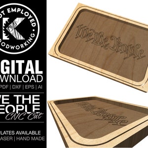 May include: A wooden tray with a raised edge and the words "We the People" engraved in a decorative font. The tray is made for CNC cutting and is available in SVG, PDF, DXF, EPS, and AI formats.
