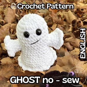 May include: A white crochet ghost plush toy with two black plastic eyes and a stitched mouth. The text on the image reads PDF Crochet Pattern, ENGLISH, and GHOST no - sew. The ghost has rounded arms and a textured, soft yarn appearance.