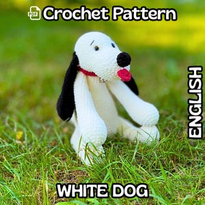 May include: A white crochet dog with black ears and a black nose, red collar and tongue, sitting on green grass. The image includes the text "Crochet Pattern" and "White Dog" in white text on a black background, and the word "English" in white text on a black background.