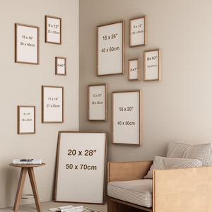 May include: A collection of framed art prints in various sizes, including 20 x 28 inches (50 x 70cm), 16 x 24 inches (40 x 60cm), and 12 x 16 inches (30 x 40cm), displayed on a neutral-colored wall. The frames have a natural wood finish.