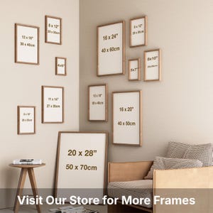 a collection of various framed artworks displayed on a wall, with sizes ranging from 8 to 16 inches. There is also a stool and a couch in the room, suggesting a cozy living space. The image does not contain any text that can be described in fewer than 500 characters.
