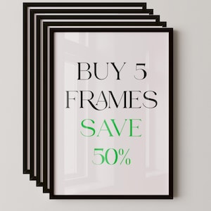 May include: Five black picture frames stacked against a white wall. The frames have a simple, modern design. Text on the frame reads "BUY 5 FRAMES SAVE 50%" in black and green font.