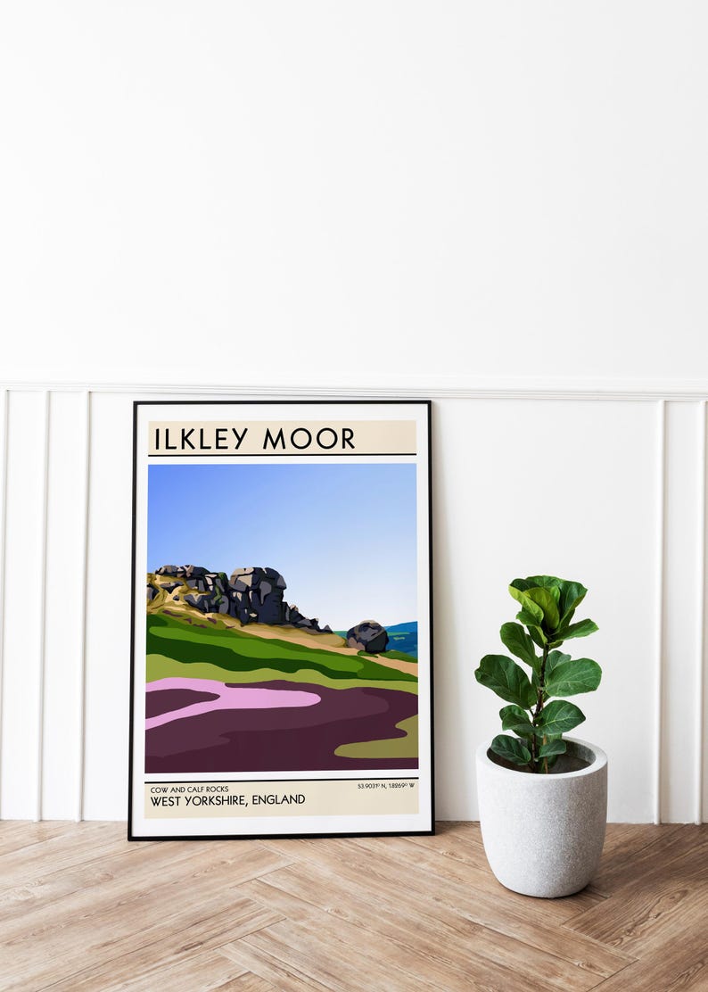 May include: A minimalist poster with a black frame featuring a landscape illustration of Cow and Calf Rocks in Ilkley Moor, West Yorkshire, England. The poster has a blue sky, green hills, and purple heather.