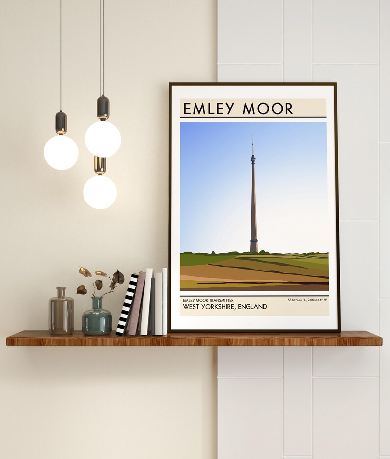 May include: A minimalist illustration of the Emley Moor Transmitter, a tall, slender tower with a red and white color scheme, set against a blue sky and green hills. The text "Emley Moor" is at the top of the image, and "Emley Moor Transmitter, West Yorkshire, England" is at the bottom.