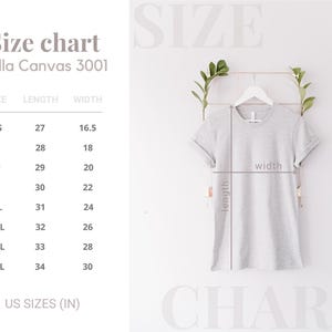 May include: A light gray Bella Canvas 3001 t-shirt hanging on a white hanger, with a size chart to the left. The chart shows measurements in inches for sizes XS to 4XL. The shirt's length and width are indicated with lines.