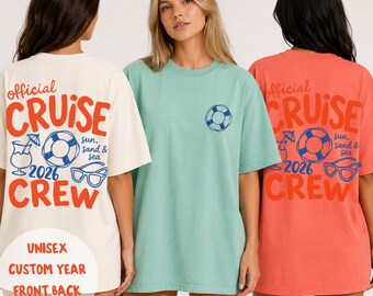 May include: Three short-sleeve t-shirts in cream, light green, and coral. The cream and coral shirts feature back graphics with the text "official CRUISE CREW 2026 sun, sand & sea" and icons of a drink, life preserver, and sunglasses.