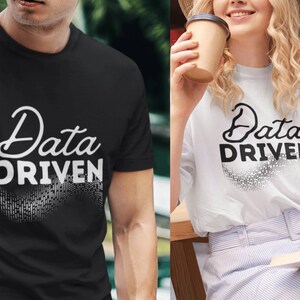 May include: Two t-shirts with the text "Data Driven" in a stylized font. The shirts are black and white and feature a pixelated design.