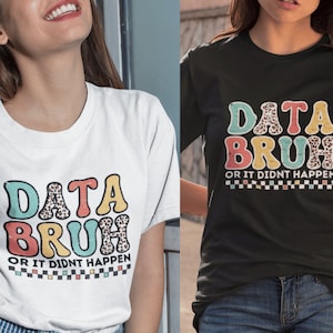 May include: Two white t-shirts with a colorful graphic that says "DATA BRUH OR IT DIDN'T HAPPEN" in a retro font. The graphic has a leopard print pattern.
