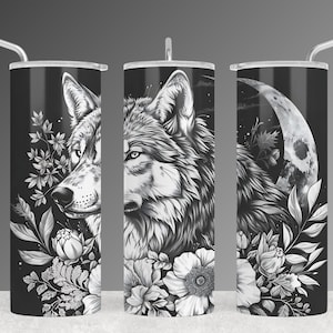 May include: Three black and white stainless steel tumblers with a wolf and floral design. The wolf is facing the left, right, and forward. The floral design includes leaves, flowers, and a crescent moon.