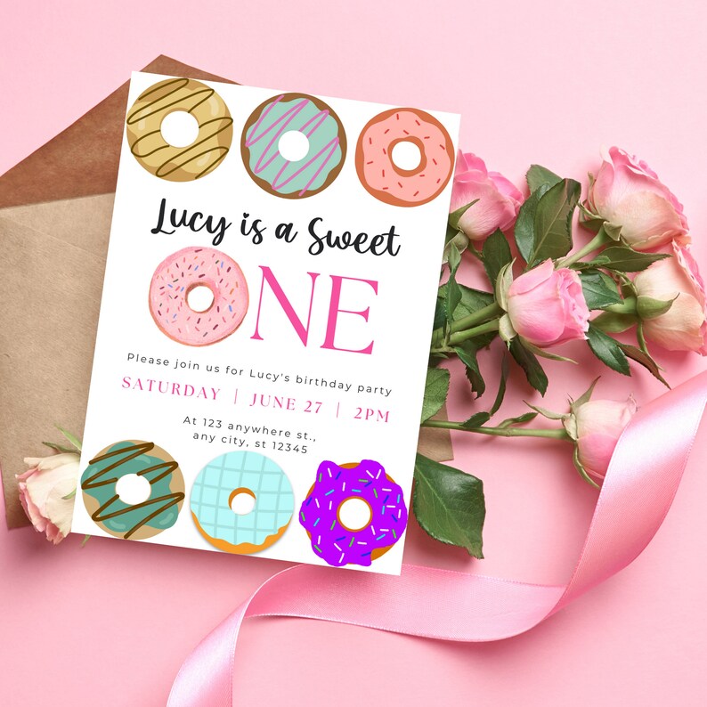 May include: A pink and white birthday invitation with the text "Lucy is a Sweet ONE" and a donut theme. The invitation includes the date and time of the party, as well as the address.