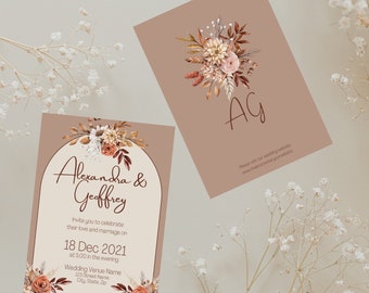 May include: A wedding invitation with a fall theme. The invitation features a floral arch with fall colors and the text "Alexandra & Geoffrey" and "Invite you to celebrate their love and marriage on 18 Dec 2021 at 5:00 in the evening". The invitation also includes the wedding venue name, address, and reception information.