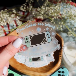 Snowflakes Are Falling, Cozy Games Are Calling Sticker: 3" Clear Waterproof Vinyl Decal for Cozy Gamers