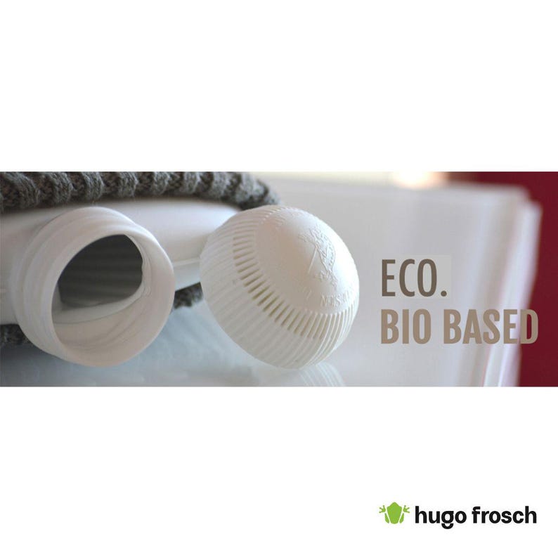May include: A white plastic water bottle with a grey fabric cover and a white plastic cap. The bottle has the text "ECO. BIO BASED" printed on it.