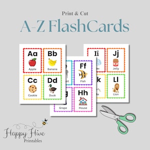 May include: A-Z flashcards with colorful illustrations of objects like an apple, banana, and cookie. The cards have a scalloped border and are labeled with the corresponding letter. The words "Print & Cut" and "Happy Hive Printables" are also visible.