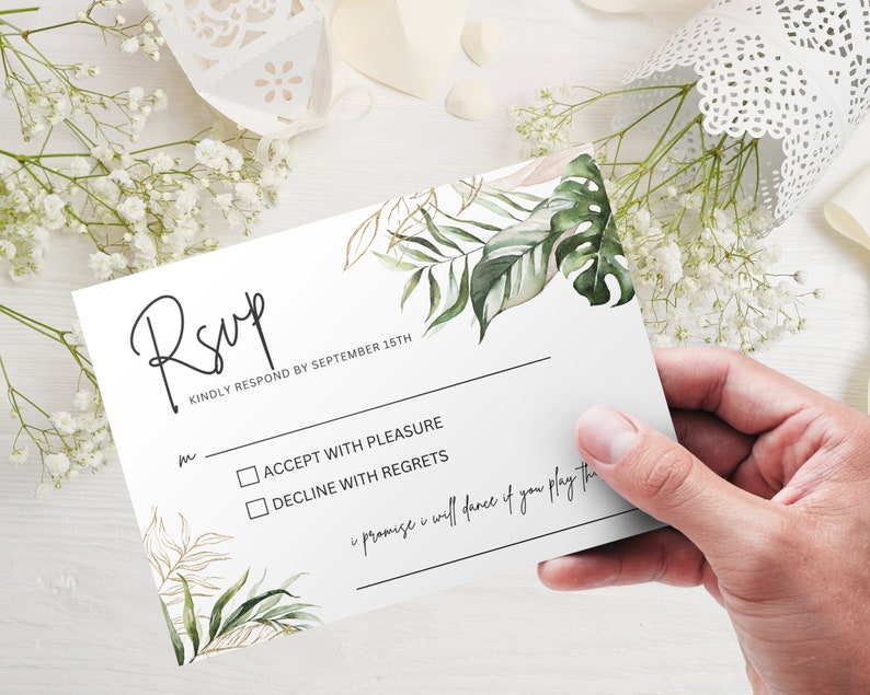 May include: RSVP card with a tropical leaf design. The card has two options: Accept with Pleasure or Decline with Regrets. The text "Kindly respond by September 15th" is printed on the card.