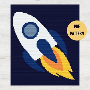 May include: A white rocket with blue flames flying through a dark blue space. The rocket has a round window and a blue tail.