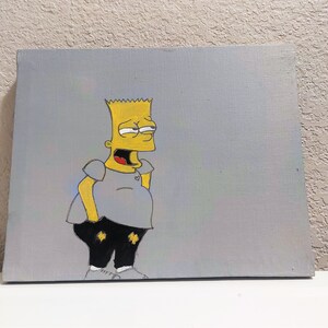 May include: A hand-painted canvas featuring a cartoon character with yellow skin, a mischievous grin, and a gray shirt and black pants. The background is a light gray.
