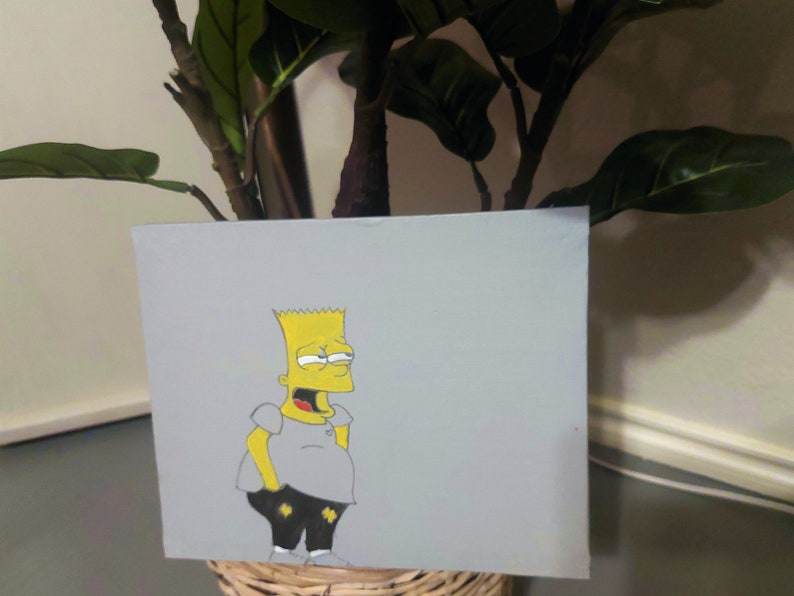 May include: A hand-painted canvas featuring a cartoon character with yellow skin, black hair, and a gray shirt. The character is standing with a slightly surprised expression.