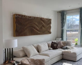 May include: A white sectional sofa with beige throw pillows in a living room with a large brown acoustic panel on the wall. The panel has a wavy design and the text "Home Decor + CA" is visible in the upper left corner of the panel.