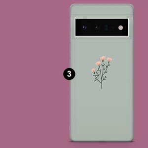 May include: A light green phone case with a floral design. The design features a cluster of pink flowers with green stems and leaves.