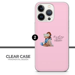 May include: A pink phone case with a clear back and a design of a woman reading a book. The text on the case says "Reading is my therapy."