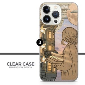 May include: A clear phone case with a fragmented design featuring a building with stars, a woman reading a book, and a moon in the sky. The text "les proverbe" is visible in the background.