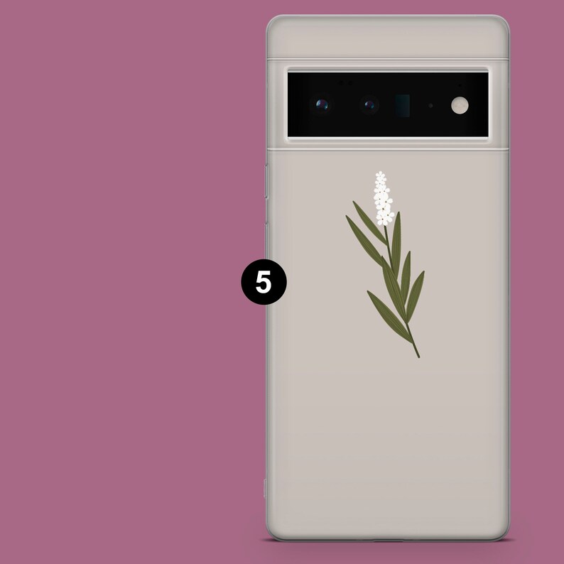 May include: A white phone case with a green floral design and a black number "5" on the side.