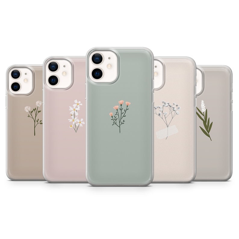May include: Five different phone cases with floral designs. The cases are clear and show the phone's camera lens. The designs include white flowers, pink flowers, and green leaves.