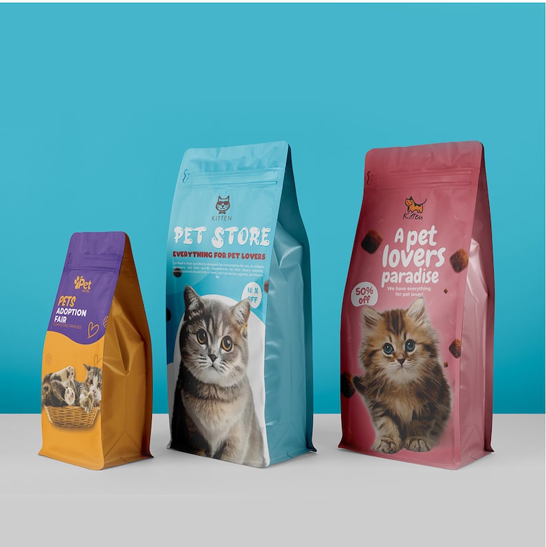 May include: Three pet food bags with different designs. The first bag is gold and purple, with the text "PETS ADOPTION FAIR". The second bag is blue with a cat image and the text "PET STORE". The third bag is pink with a kitten image and the text "A pet lovers paradise".