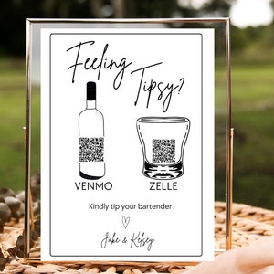 May include: A white sign with black text and illustrations. The sign reads "Feeling Tipsy?" with a wine bottle and a shot glass. The bottle has a QR code for Venmo and the shot glass has a QR code for Zelle. The sign also says "Kindly tip your bartender" and "Jake & Kelsey".