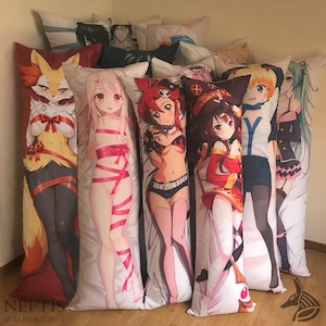 May include: A collection of long, rectangular body pillows featuring anime-style illustrations. The pillows display various colorful characters with detailed artwork. The pillows are arranged together, showcasing a variety of designs and themes.