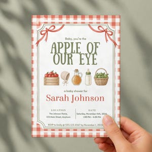 May include: A rectangular baby shower invitation with a red and white gingham border. The text reads: Baby, you're the APPLE OF OUR EYE, a baby shower for Sarah Johnson, with location, date, and RSVP details. Illustrations include apples, a bonnet, a bottle, and a basket.