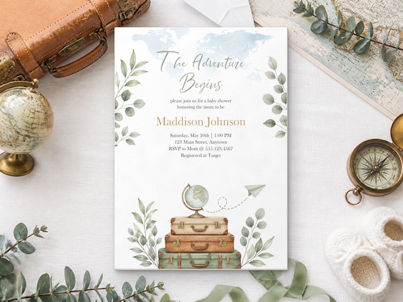 May include: A white baby shower invitation card featuring a watercolor world map, green leaves, and a stack of three vintage suitcases topped with a globe and a paper airplane. The text reads The Adventure Begins, honoring Maddison Johnson.