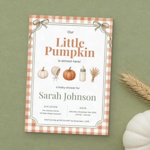 May include: A rectangular baby shower invitation with an orange and white gingham border and two gray bows at the top. The text reads Our Little Pumpkin is almost here! a baby shower for Sarah Johnson, with location and date details.