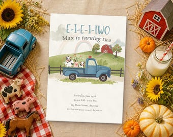 May include: A rectangular birthday invitation card featuring a watercolor farm scene with a blue pickup truck, a red barn, a rainbow, and farm animals. The text reads E-I-E-I-TWO, Max is turning two, Saturday, June 14th, 11:00 AM - 2:00 PM, 123 Main Street, Anytown, RSVP to Mom @ 555-123-4567 by June 1st.