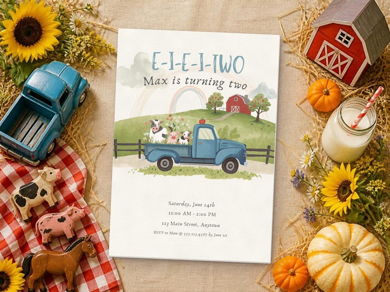 Puede incluir: Una tarjeta de invitaci&oacute;n de cumplea&ntilde;os rectangular con una escena de granja en acuarela que muestra un cami&oacute;n azul, un granero rojo, un arco&iacute;ris y animales. El texto dice E-I-E-I-TWO, Max is turning two, Saturday, June 14th, 11:00 AM - 2:00 PM, 123 Main Street, Anytown, RSVP to Mom @ 555-123-4567 by June 1st.