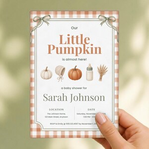 May include: A rectangular baby shower invitation with a light orange gingham border and two sage green bows at the top corners. The text reads Our Little Pumpkin is almost here, Sarah Johnson, location, date, and RSVP details with icons.