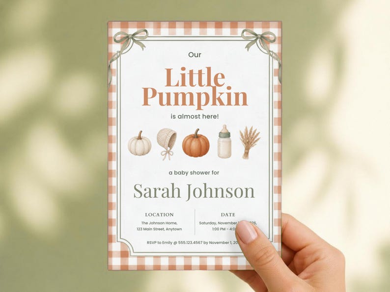 May include: A rectangular baby shower invitation with a light orange gingham border and two sage green bows at the top corners. The text reads Our Little Pumpkin is almost here, Sarah Johnson, location, date, and RSVP details with icons.