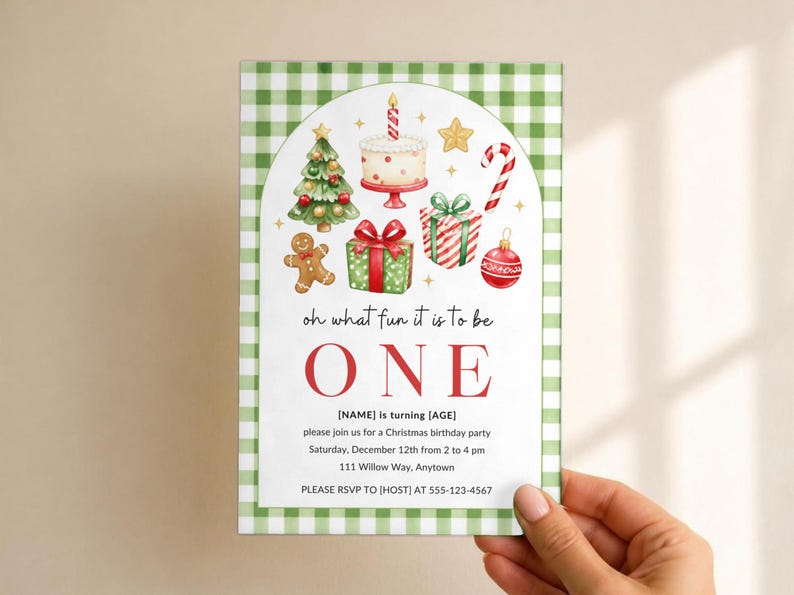 May include: A rectangular invitation card with a green and white gingham border. The center features watercolor illustrations of a Christmas tree, cake, gingerbread man, gifts, candy cane, and ornament, with the text oh what fun it is to be ONE.