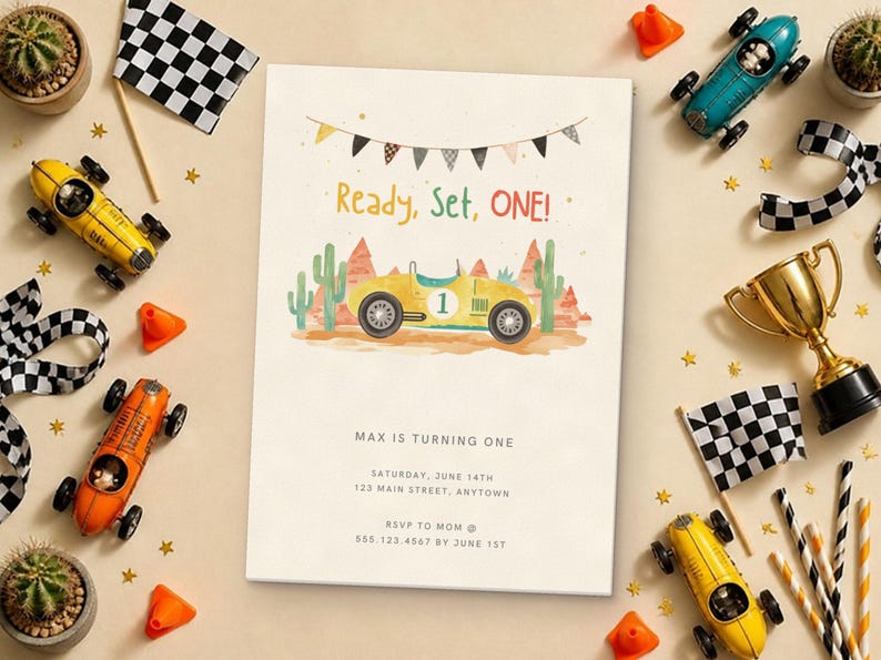 May include: A birthday invitation card featuring a yellow race car with the number one, desert landscape, and bunting. The text reads Ready, Set, ONE! Max is turning one, Saturday, June 14th, 123 Main Street, Anytown, RSVP to Mom at 555.123.4567 by June 1st.