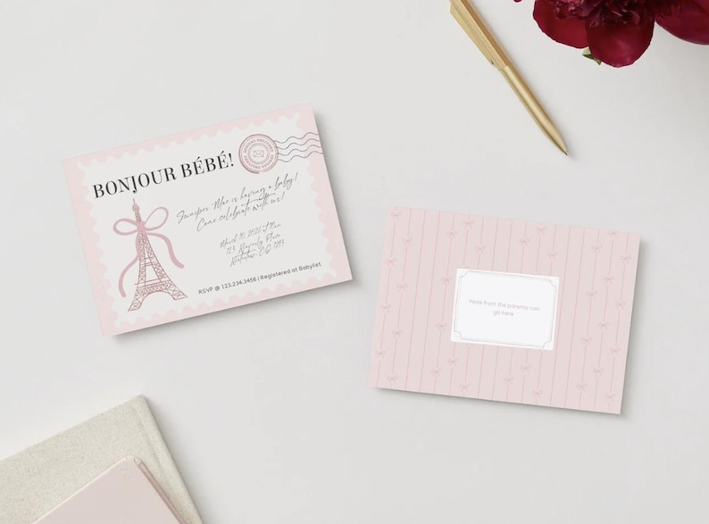 May include: A light pink baby shower invitation card featuring the text BONJOUR B&Eacute;B&Eacute;, an Eiffel Tower illustration with a bow, and a postage stamp graphic. A matching pink card with vertical stripes and a central white label is also shown.