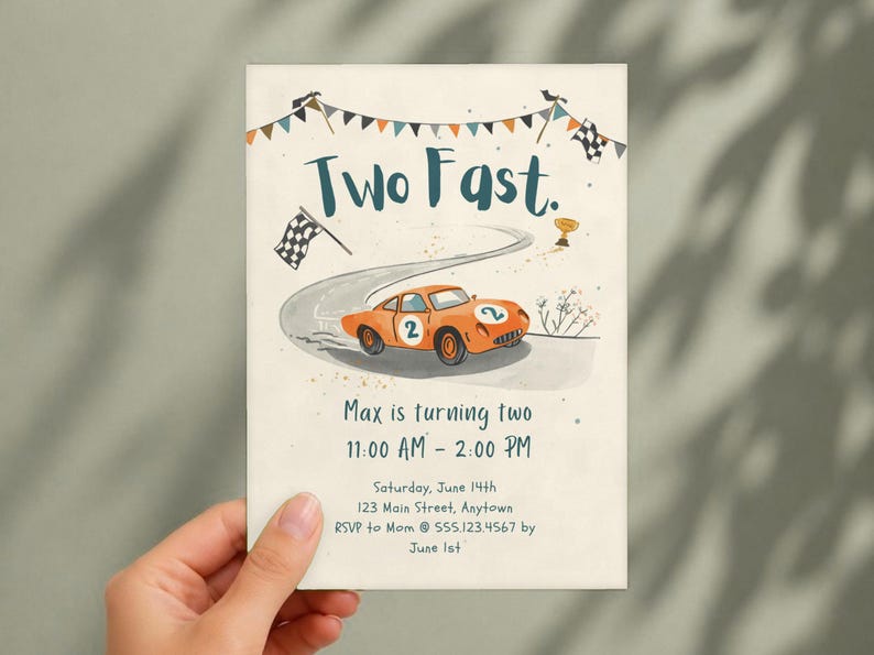May include: A rectangular invitation card featuring the text Two Fast. and Max is turning two. The design includes an orange race car with the number 2, a winding road, checkered flags, and a gold trophy on a cream-colored background.