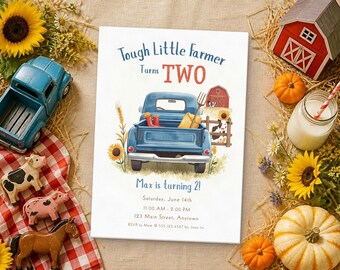 May include: A rectangular birthday invitation card featuring a blue pickup truck illustration, sunflowers, and a red barn. The text reads: Tough Little Farmer turns TWO, Max is turning 2!, Saturday, June 14th, 11:00 AM - 2:00 PM, 123 Main Street, Anytown, RSVP to Mom @ 555.123.4567 by June 1st.