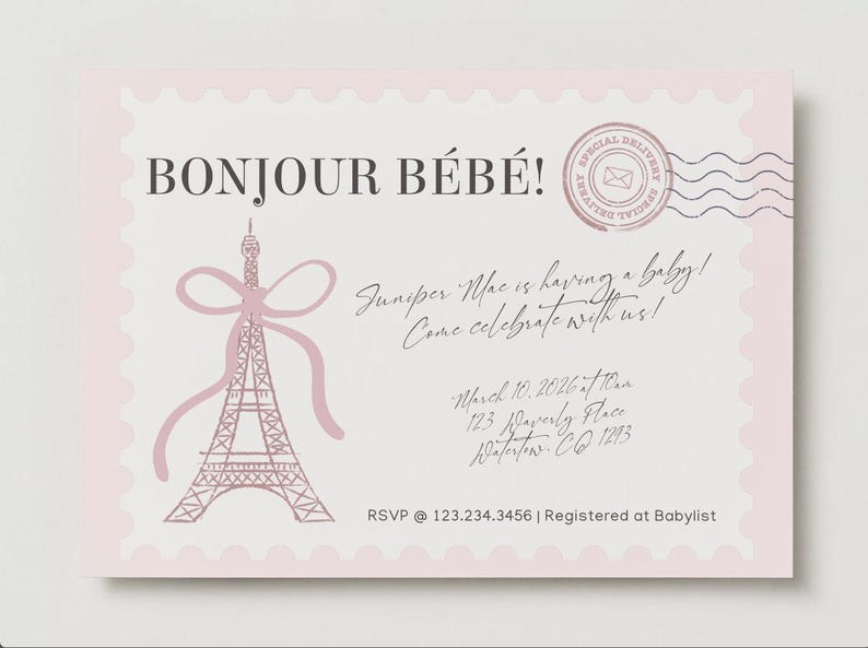 May include: A rectangular baby shower invitation card with a light pink scalloped border. It features a pink Eiffel Tower illustration with a bow, a circular postmark, and text reading BONJOUR B&Eacute;B&Eacute;! Juniper Mac is having a baby! Come celebrate with us! March 10, 2026 at 10am, 123 Waverly Place, Waterton, CO 1293, RSVP @ 123.234.3456 | Registered at Babylist.