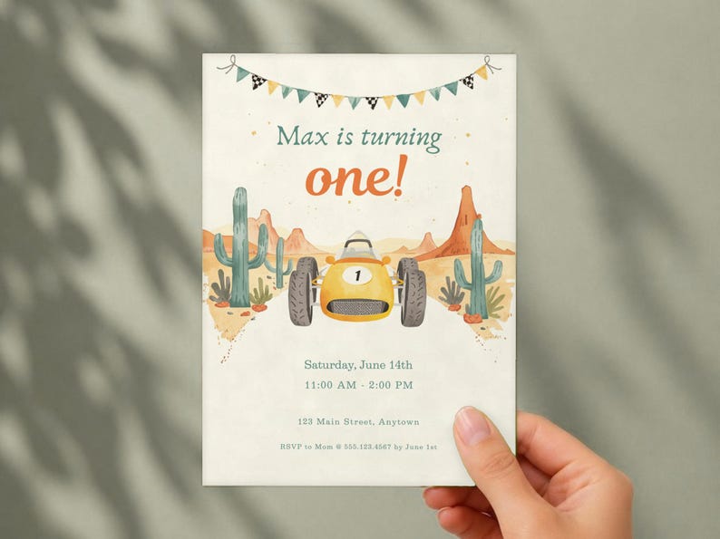 May include: A birthday invitation card featuring a yellow race car with the number one, desert cacti, and mountains. The text reads Max is turning one!, Saturday, June 14th, 11:00 AM - 2:00 PM, 123 Main Street, Anytown, and RSVP to Mom at 555.123.4567 by June 1st.
