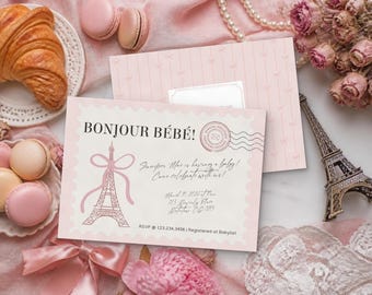 May include: A rectangular baby shower invitation card with a scalloped edge, featuring the text Bonjour Bébé!, a pink Eiffel Tower illustration with a bow, and event details including the date March 10, 2026, and RSVP 123.234.3456.