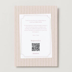 May include: A rectangular baby shower registry card with a light pink and gold vertical striped background. The white center features text about baby Elena Sofia, a QR code, and the word Amazon, all framed by a thin, decorative border.