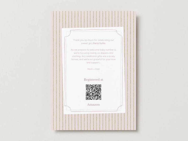 May include: A rectangular baby shower registry card with a light pink and gold vertical striped background. The white center features text about baby Elena Sofia, a QR code, and the word Amazon, all framed by a thin, decorative border.
